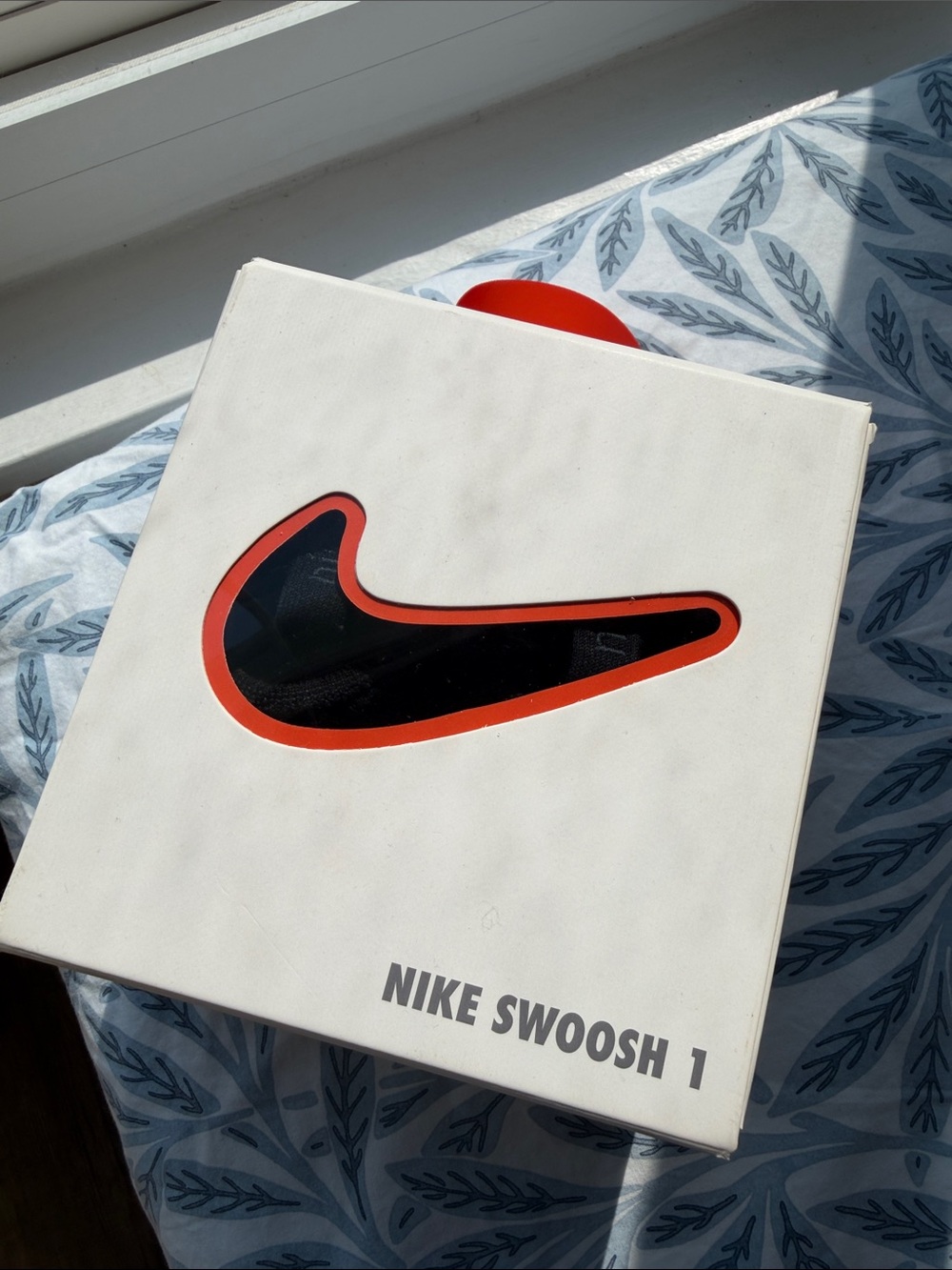 Nike White Box with Black Swoosh and Orange Outline